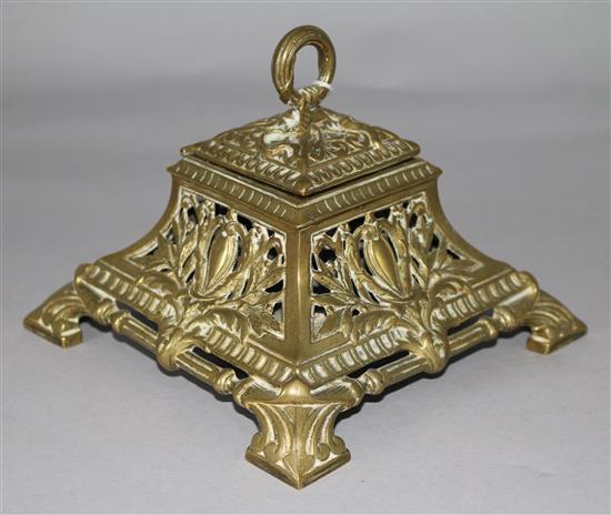 A Victorian brass inkwell